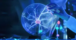 Who discovered that electrons are negatively charged?