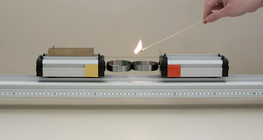 Two cars of different mass being pushed apart by a spring