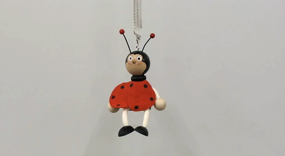 Oscillation of a toy on a spring